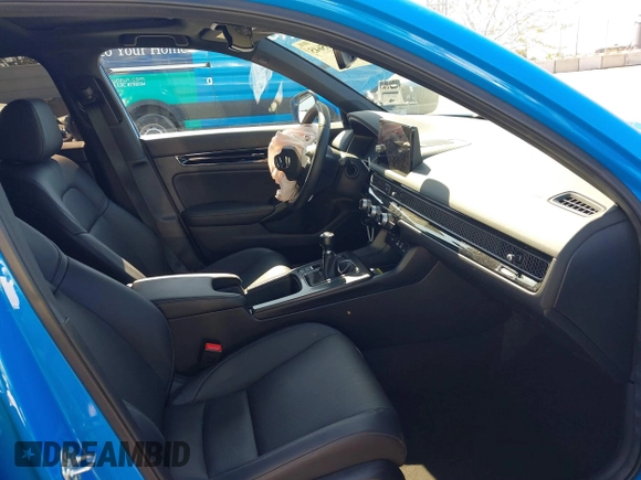 2024 Honda Civic Sport Touring z VIN 19XFL1G85RE026665, wystawiony jako IAAI lot #41735645 z przebiegiem 5025 mil mil oraz . Historia ofert i sprzedaży dostępna na DreamBid. Obrazek 5.
