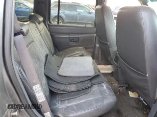 1999 Ford Explorer XLT z VIN 1FMZU32E4XUA16402, wystawiony jako Copart lot #85243074 z przebiegiem 148 110 mil mil oraz Szkoda całkowita • Salvage title. Historia ofert i sprzedaży dostępna na DreamBid. Obrazek 11.