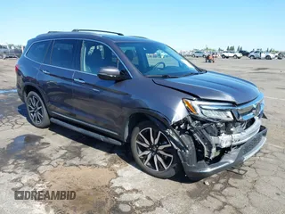 2021 Honda Pilot Touring 8-Passenger with VIN 5FNYF6H97MB034399, listed as a IAAI auction lot 42303419 with 50,034 mi miles and . Bid and sale history available at DreamBid. Image 1.