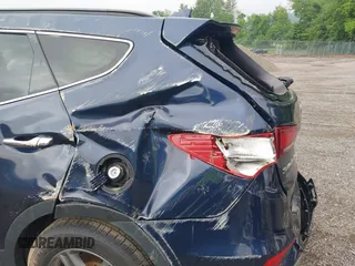 2017 Hyundai Santa Fe 2.4L z VIN 5XYZUDLB9HG421284, wystawiony jako IAAI lot #42441436 z przebiegiem 96 155 mil mil oraz . Historia ofert i sprzedaży dostępna na DreamBid. Obrazek 13.