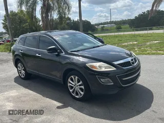 2012 Mazda CX-9 Grand Touring z VIN JM3TB2DA0C0350679, wystawiony jako Copart lot #59038715 z przebiegiem 145 135 mil mil oraz Tytuł czysty. Historia ofert i sprzedaży dostępna na DreamBid. Obrazek 1.