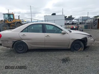 2002 Toyota Camry LE z VIN 4T1BE32K72U028489, wystawiony jako IAAI lot #41760604 z przebiegiem 163 950 mil mil oraz . Historia ofert i sprzedaży dostępna na DreamBid. Obrazek 14.