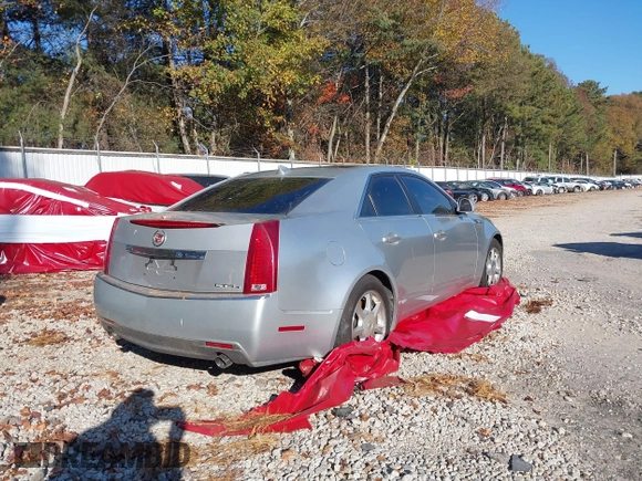2009 Cadillac CTS AWD w/1SA with VIN 1G6DG577990113457, listed as a IAAI auction lot 38002705 with 101,298 mi miles. Bid and sale history available at carsss.com. Image 4.