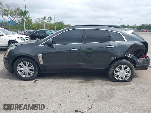 2015 Cadillac SRX with VIN 3GYFNAE30FS569009, listed as a IAAI auction lot 41718522 with 104,448 mi miles and . Bid and sale history available at DreamBid. Image 14.