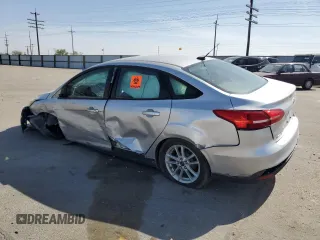 2015 Ford Focus SE with VIN 1FADP3F28FL241020, listed as a Copart auction lot 54559135 with 123,008 mi miles and Salvage title. Bid and sale history available at DreamBid. Image 2.