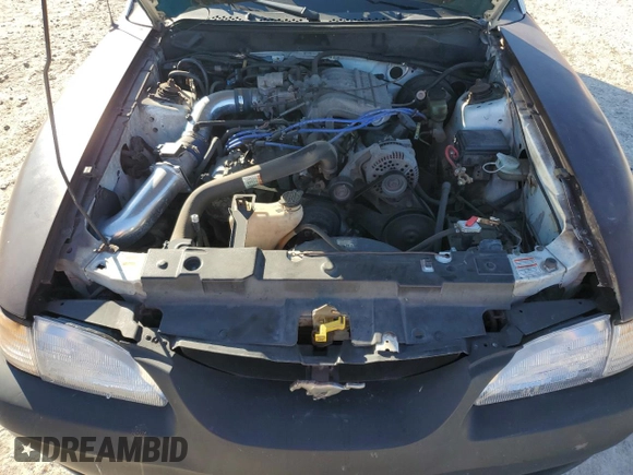 1997 Ford Mustang with VIN 1FALP4043VF174092, listed as a Copart auction lot 86983884 with 105,774 mi miles and Salvage Title. Bid and sale history available at carsss.com. Image 12.