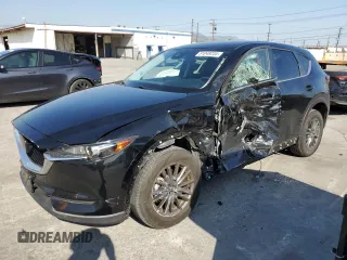 2021 Mazda CX-5 Touring with VIN JM3KFBCM8M0495899, listed as a Copart auction lot 51049235 with 31,164 mi miles and Salvage Title. Bid and sale history available at carsss.com. Image 1.