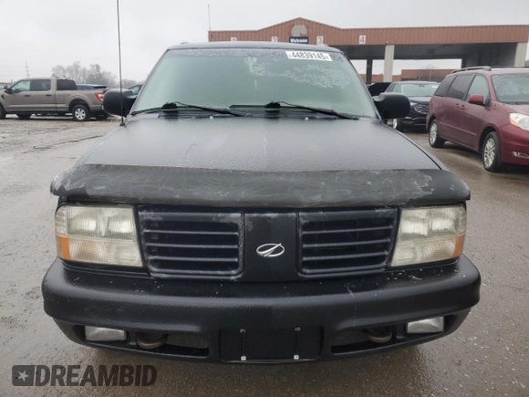 2000 Oldsmobile Bravada z VIN 1GHDT13W5Y2311819, wystawiony jako Copart lot #44839145 z przebiegiem 163 427 mil mil oraz Tytuł czysty. Historia ofert i sprzedaży dostępna na DreamBid. Obrazek 5.