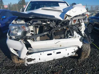 2014 Toyota Tacoma with VIN 5TFUU4EN1EX088377, listed as a IAAI auction lot 41443682 with 67,185 mi miles and . Bid and sale history available at DreamBid. Image 6.