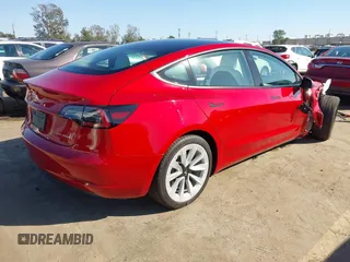 2021 Tesla Model 3 Long Range with VIN 5YJ3E1EBXMF990242, listed as a IAAI auction lot 41674222 with 24,554 mi miles and . Bid and sale history available at DreamBid. Image 4.