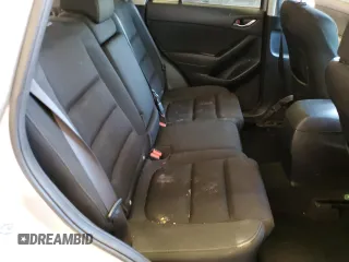 2016 Mazda CX-5 Touring with VIN JM3KE2CY0G0771566, listed as a Copart auction lot 52688255 with 142,204 mi miles and Salvage Title. Bid and sale history available at carsss.com. Image 12.