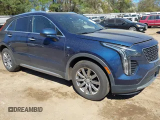 2019 Cadillac XT4 FWD Premium Luxury z VIN 1GYFZCR47KF109394, wystawiony jako IAAI lot #41864606 z przebiegiem 98 425 mil mil oraz . Historia ofert i sprzedaży dostępna na DreamBid. Obrazek 1.