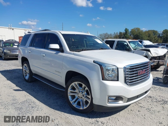 2019 GMC Yukon SLT with VIN 1GKS1BKC9KR332014, listed as a IAAI auction lot 40674460 with 76,545 mi miles. Bid and sale history available at carsss.com. Image 1.
