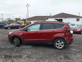2016 Ford Escape SE with VIN 1FMCU9GX8GUB28820, listed as a IAAI auction lot 40874359 with 134,459 mi miles. Bid and sale history available at carsss.com. Image 14.