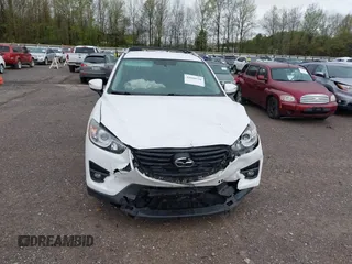 2016 Mazda CX-5 Touring with VIN JM3KE4CY0G0903723, listed as a IAAI auction lot 41966516 with 107,569 mi miles. Bid and sale history available at carsss.com. Image 12.