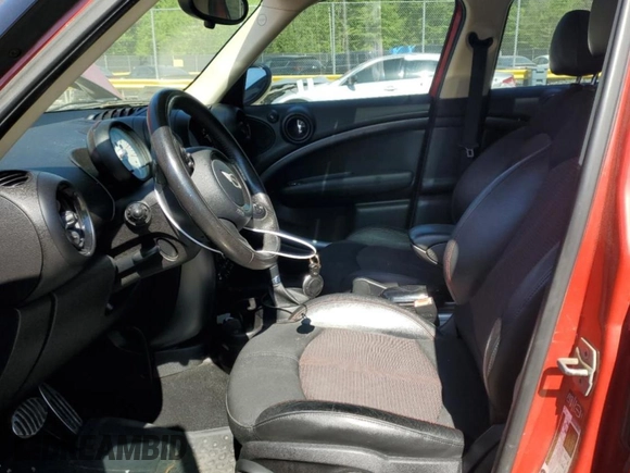 2014 MINI Countryman S with VIN WMWZC3C54EWP25321, listed as a Copart auction lot 54898515 with 48,530 mi miles and Salvage Title. Bid and sale history available at DreamBid. Image 7.