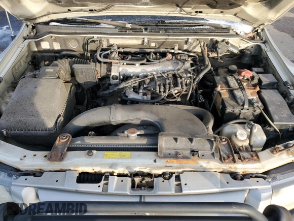 2002 Mitsubishi Montero Limited z VIN JA4MW51R12J020808, wystawiony jako Copart lot #41915255 z przebiegiem 127 834 mil mil oraz Czysty tytuł • Clean title. Historia ofert i sprzedaży dostępna na DreamBid. Obrazek 12.