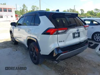 2021 Toyota RAV4 Hybrid XSE with VIN 2T3E6RFV9MW019837, listed as a IAAI auction lot 42002574 with 74,214 mi miles. Bid and sale history available at carsss.com. Image 3.
