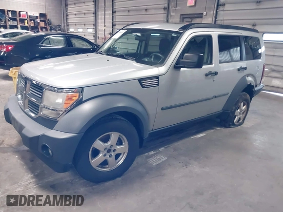 2007 Dodge Nitro SXT with VIN 1D8GU28K47W569317, listed as a IAAI auction lot 41740052 with 220,265 mi miles. Bid and sale history available at carsss.com. Image 2.