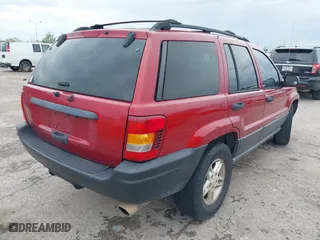 2004 Jeep Grand Cherokee Laredo with VIN 1J4GX48S14C259215, listed as a IAAI auction lot 41906121 with 142,668 mi miles. Bid and sale history available at carsss.com. Image 4.