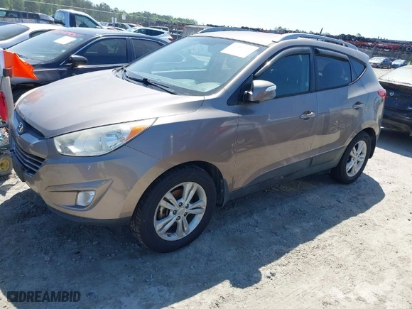 2013 Hyundai Tucson GLS with VIN KM8JU3AC0DU557505, listed as a IAAI auction lot 42017594 with 159,551 mi miles. Bid and sale history available at carsss.com. Image 2.