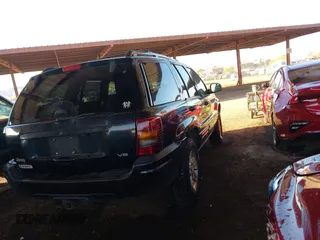 1999 Jeep Grand Cherokee Limited with VIN 1J4GW68N6XC675399, listed as a IAAI auction lot 41745815 with 217,800 mi miles. Bid and sale history available at carsss.com. Image 4.