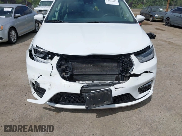2023 Chrysler Pacifica Hybrid Touring L with VIN 2C4RC1L77PR541513, listed as a IAAI auction lot 42433421 with 53,979 mi miles and . Bid and sale history available at DreamBid. Image 6.