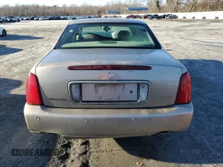 2003 Cadillac DeVille DTS z VIN 1G6KF57963U125853, wystawiony jako Copart lot #42559975 z przebiegiem Nie podano mil oraz Szkody całkowita. Historia ofert i sprzedaży dostępna na DreamBid. Obrazek 6.