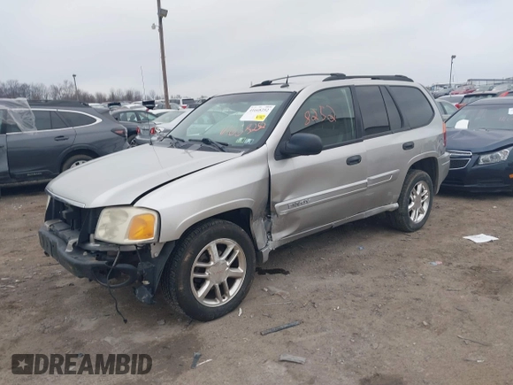 2004 GMC Envoy SLE with VIN 1GKDT13SX42135951, listed as a IAAI auction lot 41668252 with 216,193 mi miles. Bid and sale history available at carsss.com. Image 2.