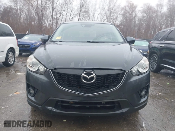 2014 Mazda CX-5 Grand Touring with VIN JM3KE4DY0E0392476, listed as a IAAI auction lot 41419144 with 89,245 mi miles and . Bid and sale history available at carsss.com. Image 12.