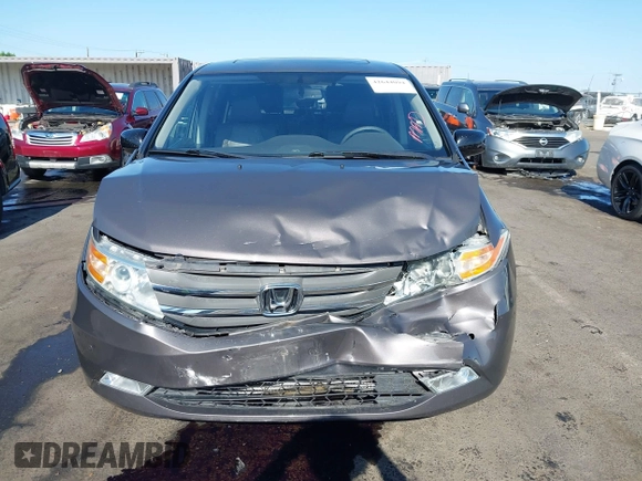 2012 Honda Odyssey Touring with VIN 5FNRL5H95CB057346, listed as a IAAI auction lot 42644094 with 114,712 mi miles and . Bid and sale history available at DreamBid. Image 13.
