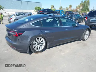 2018 Tesla Model 3 Long Range Battery with VIN 5YJ3E1EA4JF024102, listed as a IAAI auction lot 42100621 with 86,298 mi miles and . Bid and sale history available at DreamBid. Image 4.