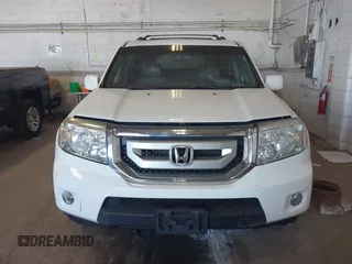2010 Honda Pilot Touring with VIN 5FNYF4H95AB019903, listed as a IAAI auction lot 42196082 with 233,527 mi miles and . Bid and sale history available at carsss.com. Image 12.