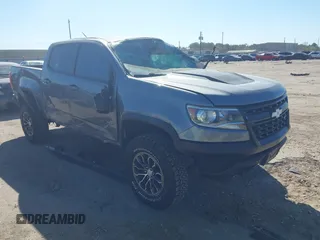2018 Chevrolet Colorado 4WD ZR2 z VIN 1GCGTEEN0J1115894, wystawiony jako IAAI lot #41774860 z przebiegiem 71 698 mil mil oraz . Historia ofert i sprzedaży dostępna na DreamBid. Obrazek 1.