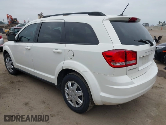 2014 Dodge Journey American Value with VIN 3C4PDCAB8ET141803, listed as a IAAI auction lot 42097292 with 76,339 mi miles and . Bid and sale history available at DreamBid. Image 3.