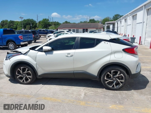 2021 Toyota C-HR LE with VIN JTNKHMBX8M1104427, listed as a IAAI auction lot 41948234 with 24,415 mi miles. Bid and sale history available at carsss.com. Image 14.