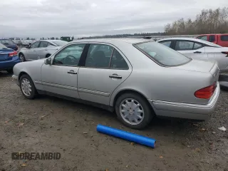 1999 Mercedes-Benz E-Class with VIN WDBJF65H5XA906877, listed as a Copart auction lot 76156014 with 141,956 mi miles and Clean Title. Bid and sale history available at carsss.com. Image 2.