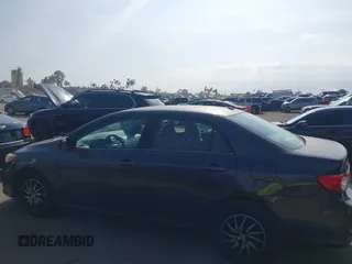 2011 Toyota Corolla L with VIN JTDBU4EE3BJ090749, listed as a IAAI auction lot 42106633 with 209,824 mi miles. Bid and sale history available at carsss.com. Image 15.