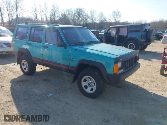 1996 Jeep Cherokee Sport z VIN 1J4FJ68S2TL103997, wystawiony jako IAAI lot #41517835 z przebiegiem 175 560 mil mil oraz . Historia ofert i sprzedaży dostępna na DreamBid. Obrazek 1.