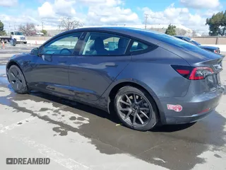 2023 Tesla Model 3 with VIN 5YJ3E1EA0PF698076, listed as a IAAI auction lot 41744362 with 12,838 mi miles. Bid and sale history available at carsss.com. Image 3.