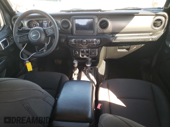 2023 Jeep Wrangler Sport with VIN 1C4HJXDN1PW701944, listed as a Copart auction lot 69973104 with 24,733 mi miles and Salvage Title. Bid and sale history available at DreamBid. Image 8.