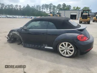 2014 Volkswagen Beetle 1.8T w/Premium z VIN 3VW517AT6EM816698, wystawiony jako Copart lot #57344055 z przebiegiem 52 782 mil mil oraz Szkody całkowita. Historia ofert i sprzedaży dostępna na DreamBid. Obrazek 2.