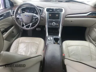 2017 Ford Fusion Titanium z VIN 3FA6P0SUXHR268559, wystawiony jako Copart lot #57456085 z przebiegiem 124 072 mil mil oraz Szkoda całkowita • Salvage title. Historia ofert i sprzedaży dostępna na DreamBid. Obrazek 8.
