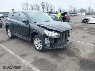 2013 Mazda CX-5 Sport with VIN JM3KE2BE3D0123822, listed as a IAAI auction lot 41668675 with 157,636 mi miles. Bid and sale history available at carsss.com. Image 1.