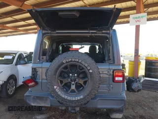 2021 Jeep Wrangler Unlimited Sport S with VIN 1C4HJXDG5MW695014, listed as a IAAI auction lot 41692838 with 66,247 mi miles and . Bid and sale history available at DreamBid. Image 16.