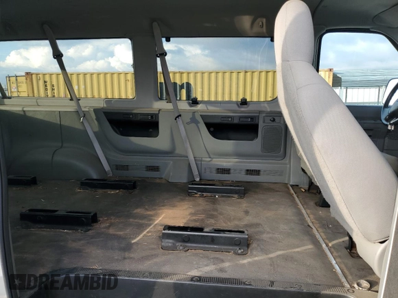 2009 Ford Econoline Passenger XL with VIN 1FBNE31L39DA86660, listed as a Copart auction lot 43724115 with 562,883 mi miles and Salvage title. Bid and sale history available at DreamBid. Image 11.