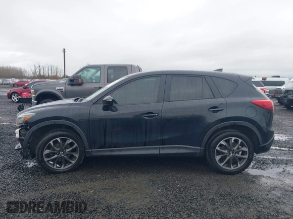 2016 Mazda CX-5 Grand Touring z VIN JM3KE4DY5G0742686, wystawiony jako IAAI lot #41598719 z przebiegiem 117 643 mil mil oraz . Historia ofert i sprzedaży dostępna na DreamBid. Obrazek 15.