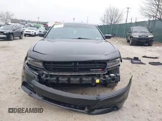 2019 Dodge Charger SXT with VIN 2C3CDXJG7KH757728, listed as a IAAI auction lot 41797017 with 68,063 mi miles and . Bid and sale history available at DreamBid. Image 11.