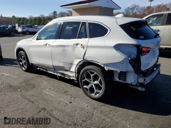 2016 BMW X1 xDrive28i with VIN WBXHT3C32G5E52052, listed as a Copart auction lot 79522024 with 76,995 mi miles and Salvage Title. Bid and sale history available at carsss.com. Image 2.