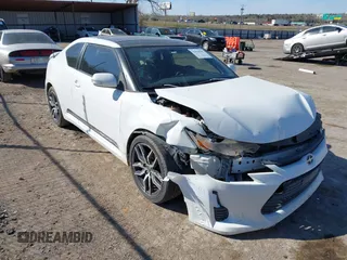 2014 Scion tC z VIN JTKJF5C74E3072410, wystawiony jako IAAI lot #41810965 z przebiegiem 147 164 mil mil oraz . Historia ofert i sprzedaży dostępna na DreamBid. Obrazek 1.